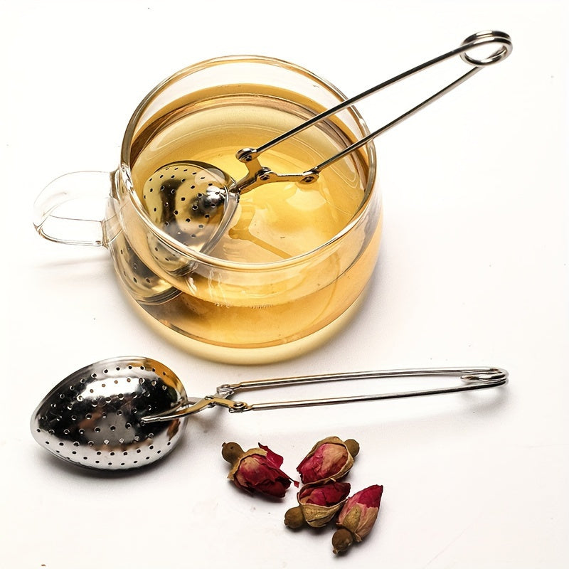 Heart-shaped stainless steel tea infuser with long handle, perfect for steeping loose leaf or herbal tea in the comfort of your home, restaurant, hotel, or office. A versatile tea accessory for your teaware collection.