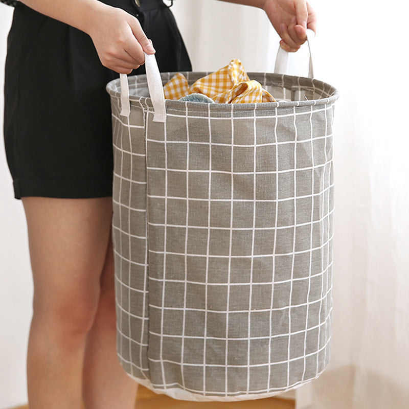 One piece of an extra-large round laundry basket with handles in a classic black and white grid and gray line patterns. Versatile for any room, this portable dirty clothes hamper is perfect for your laundry needs.