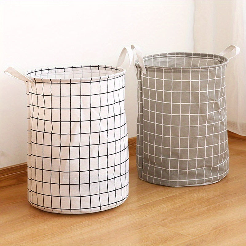 One piece of an extra-large round laundry basket with handles in a classic black and white grid and gray line patterns. Versatile for any room, this portable dirty clothes hamper is perfect for your laundry needs.