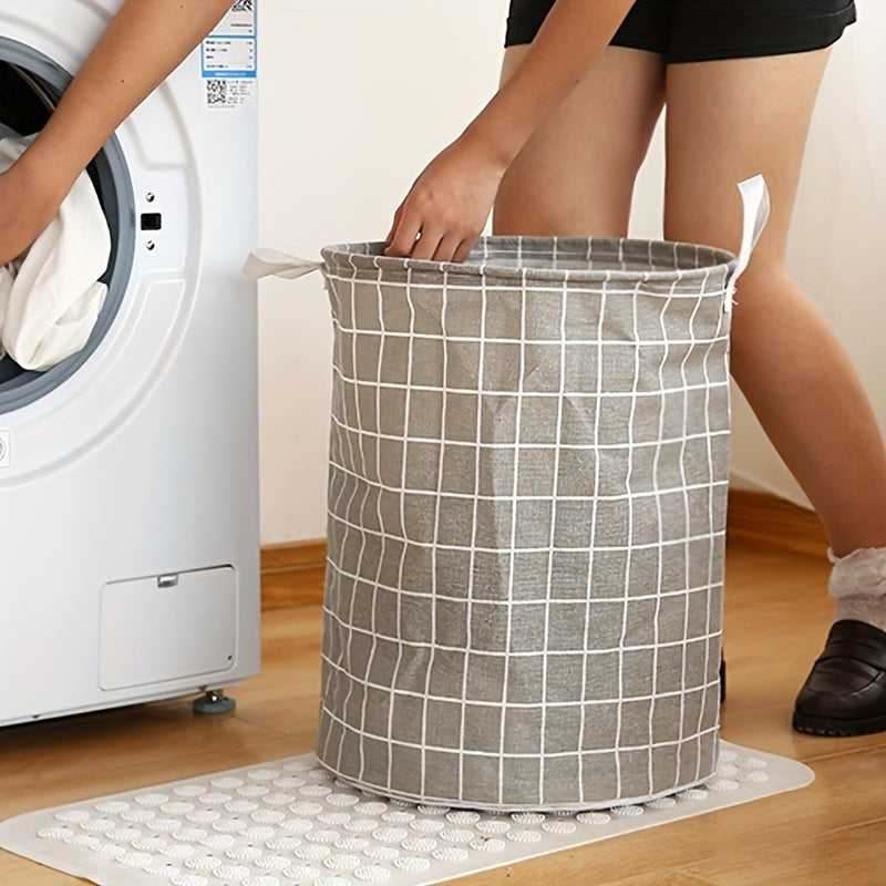 One piece of an extra-large round laundry basket with handles in a classic black and white grid and gray line patterns. Versatile for any room, this portable dirty clothes hamper is perfect for your laundry needs.