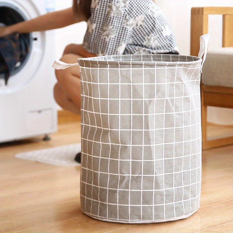 One piece of an extra-large round laundry basket with handles in a classic black and white grid and gray line patterns. Versatile for any room, this portable dirty clothes hamper is perfect for your laundry needs.