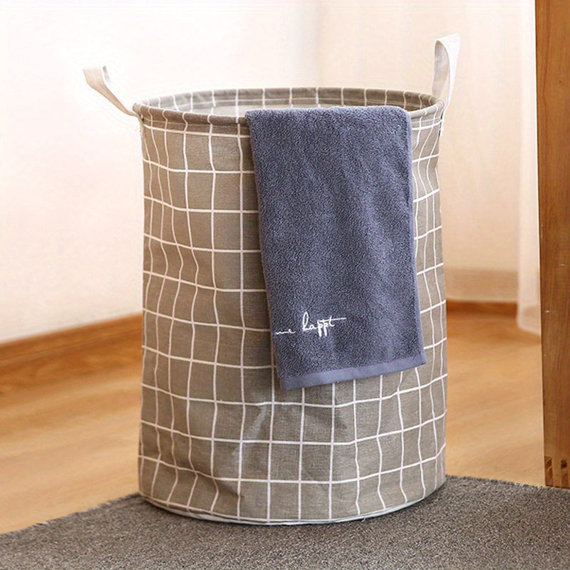 One piece of an extra-large round laundry basket with handles in a classic black and white grid and gray line patterns. Versatile for any room, this portable dirty clothes hamper is perfect for your laundry needs.