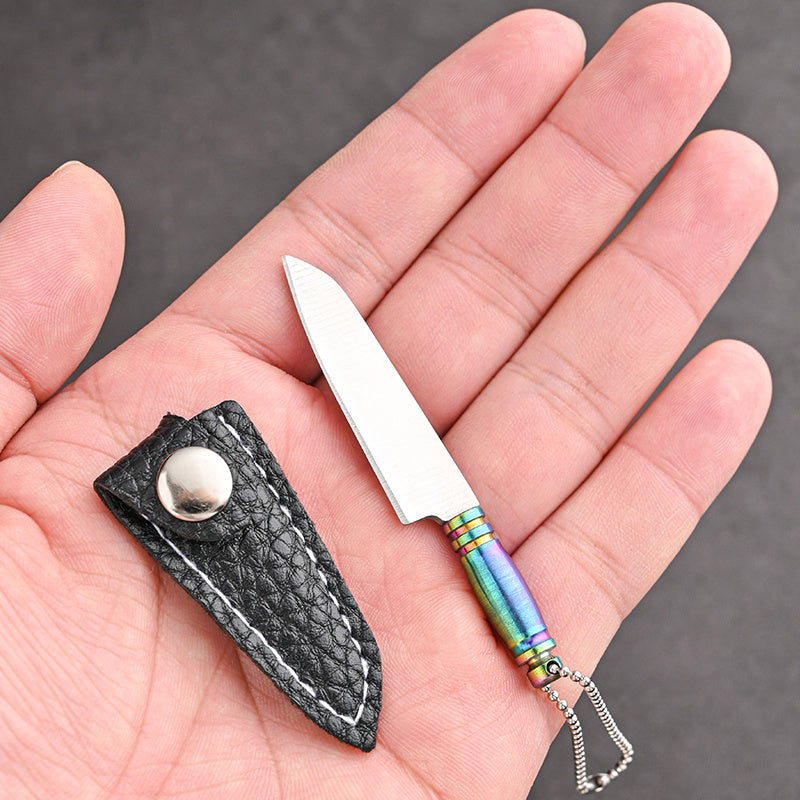 Mini keychain knife made of stainless steel - a portable, handmade novelty tool perfect for outdoor activities such as camping and fishing.