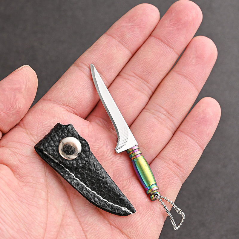 Mini keychain knife made of stainless steel - a portable, handmade novelty tool perfect for outdoor activities such as camping and fishing.