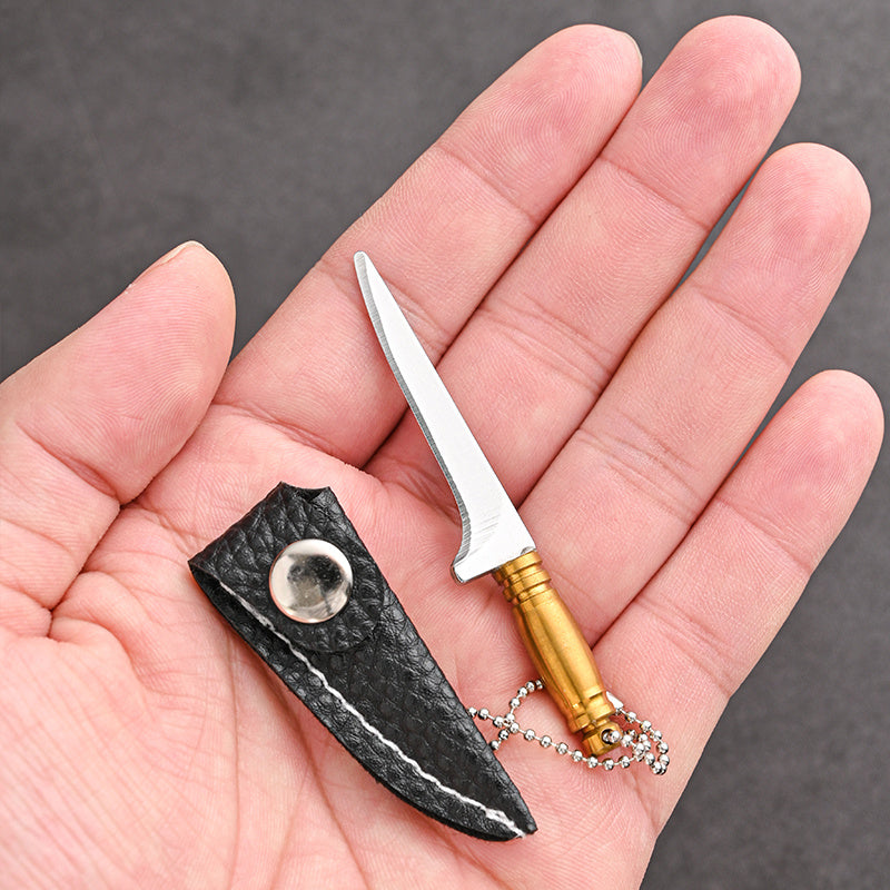 Mini keychain knife made of stainless steel - a portable, handmade novelty tool perfect for outdoor activities such as camping and fishing.