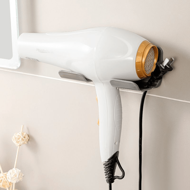 Wall-mounted storage rack keeps hair dryer and accessories neat without drilling.