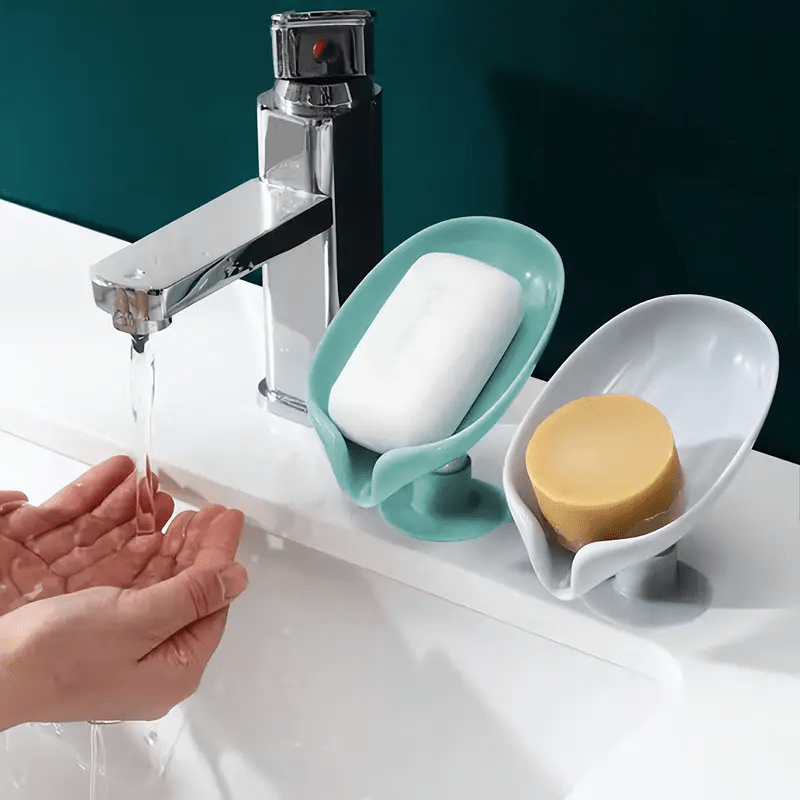 Plastic leaf-shaped soap holder with standing suction cup design, no punching needed. Water-resistant soap dish for bathroom.