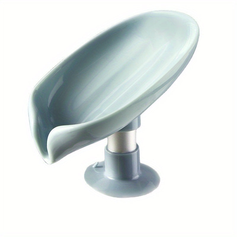 Plastic leaf-shaped soap holder with standing suction cup design, no punching needed. Water-resistant soap dish for bathroom.