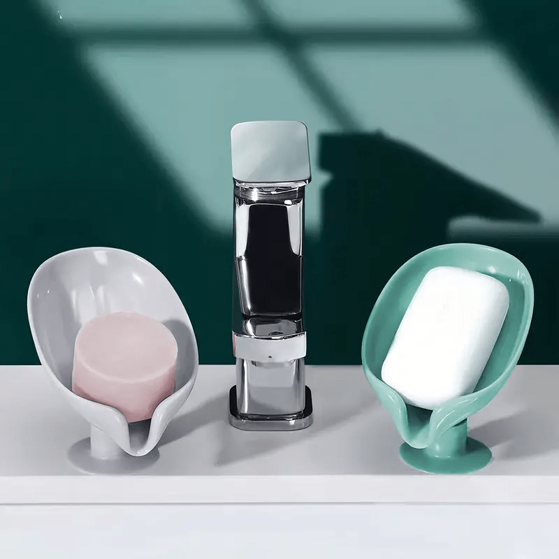 Plastic leaf-shaped soap holder with standing suction cup design, no punching needed. Water-resistant soap dish for bathroom.