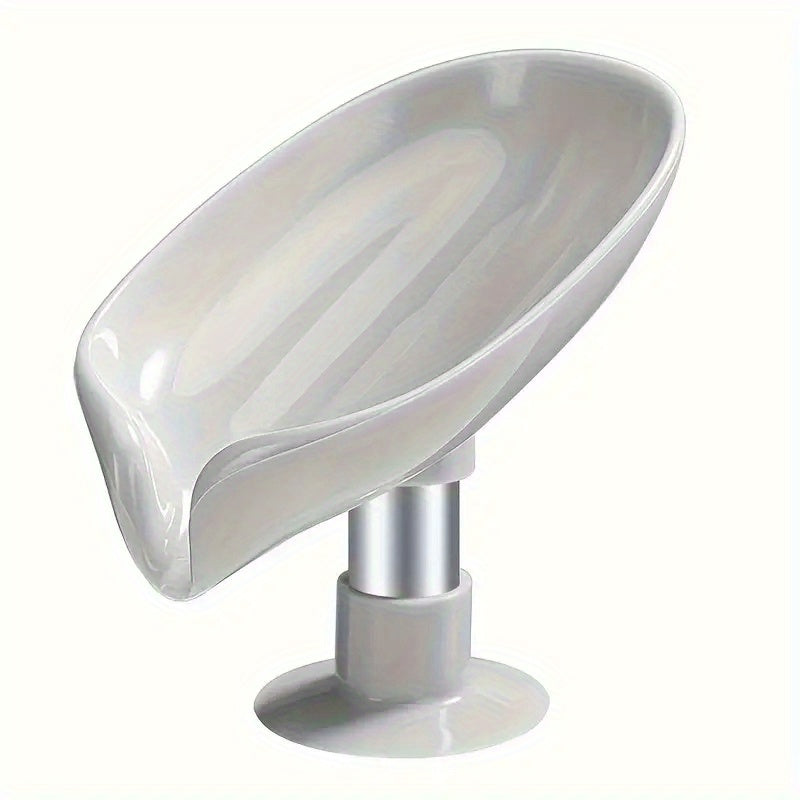 Plastic leaf-shaped soap holder with standing suction cup design, no punching needed. Water-resistant soap dish for bathroom.