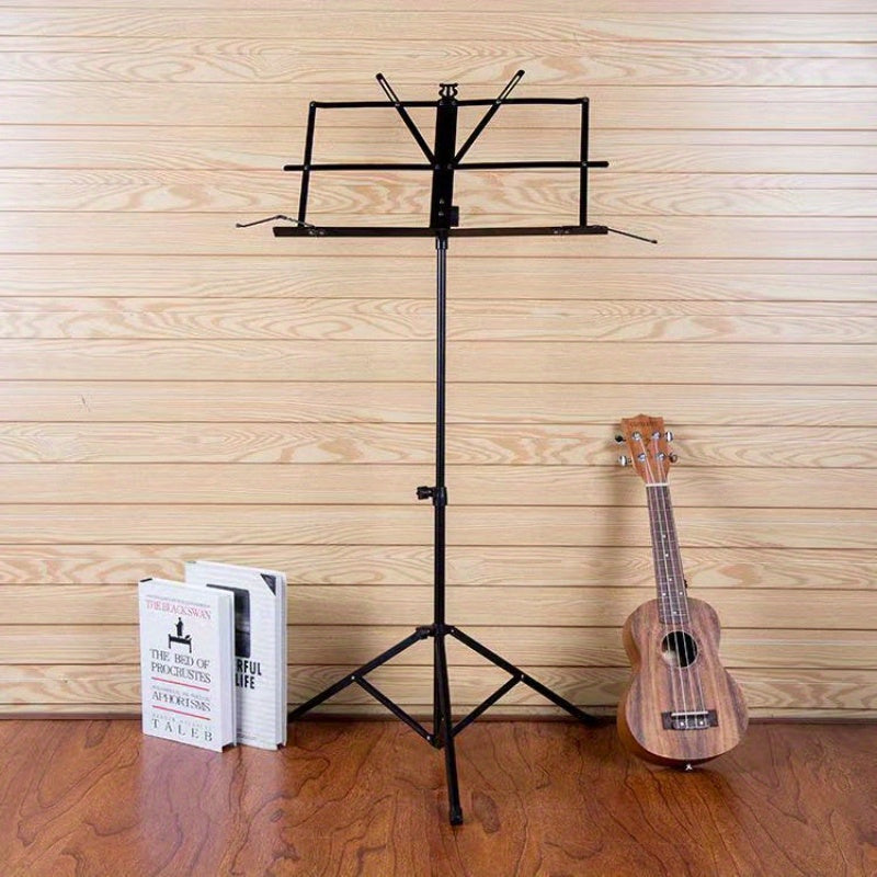 Portable folding music stand for piano, guitar, ukulele, and violin with durable alloy construction.