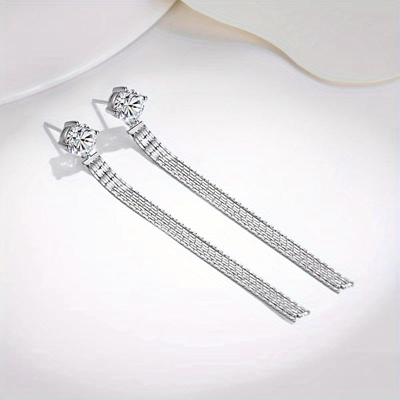 These 925 Sterling Silver stud earrings feature a total of 2 carats of Moissanite stones in a tassel design. They exude a Korean version of simple, yet trendy style, perfect for both men and women. The high-end and creative design showcases a lively and