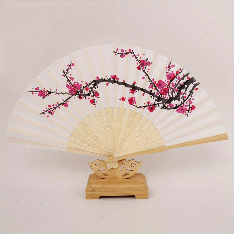 Discover the charm of 10 exquisite Elegant Cherry Blossom Silk Folding Hand Fans - perfect for Wedding Favors, Chinese New Year Gifts, and Party Accessories. Featuring a Compact & Lightweight design with a Durable Plastic Handle, these fans are Reusable