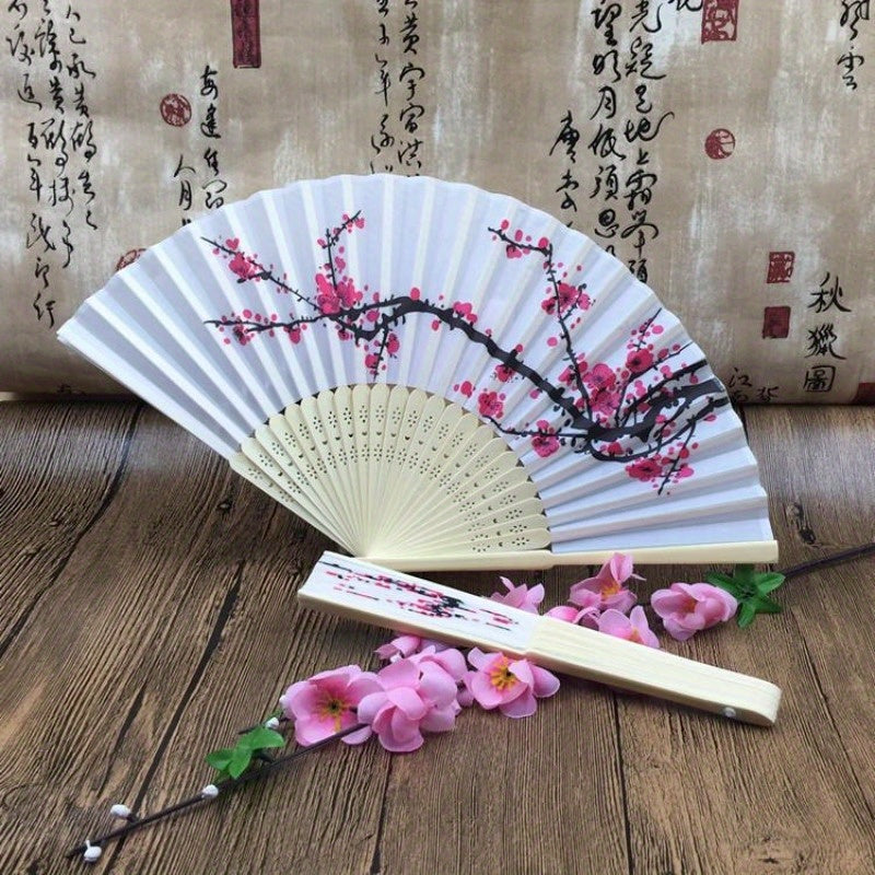 Discover the charm of 10 exquisite Elegant Cherry Blossom Silk Folding Hand Fans - perfect for Wedding Favors, Chinese New Year Gifts, and Party Accessories. Featuring a Compact & Lightweight design with a Durable Plastic Handle, these fans are Reusable