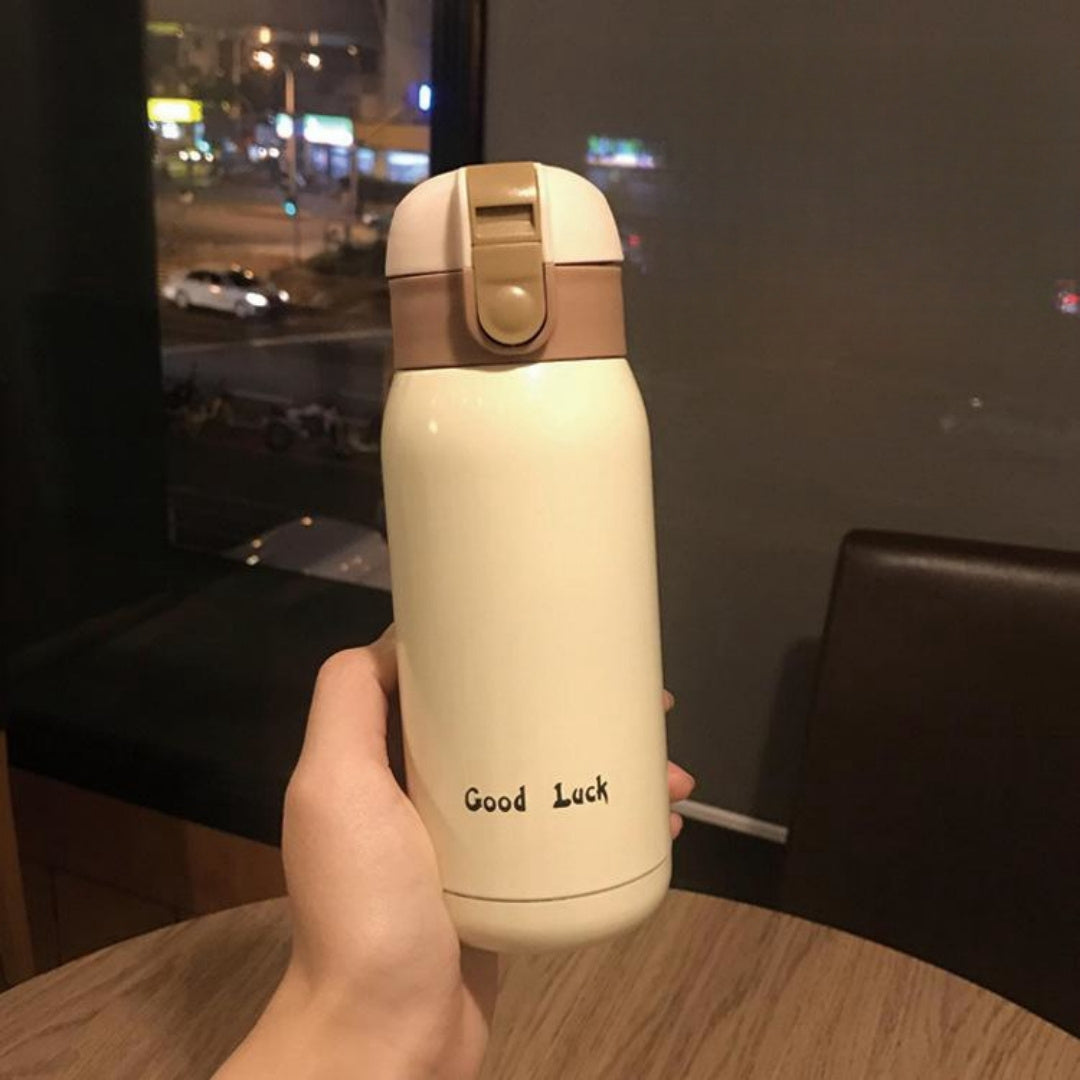 Insulated Water Bottle with Carry Strap made of Stainless Steel - Leakproof, Portable Travel Mug for Hot and Cold Drinks, Perfect for Outdoor Adventures & Halloween Presents.