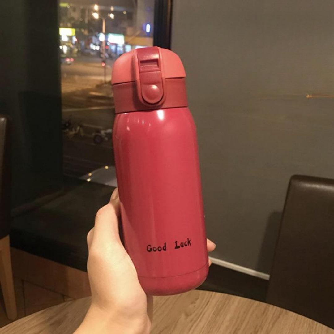 Insulated Water Bottle with Carry Strap made of Stainless Steel - Leakproof, Portable Travel Mug for Hot and Cold Drinks, Perfect for Outdoor Adventures & Halloween Presents.