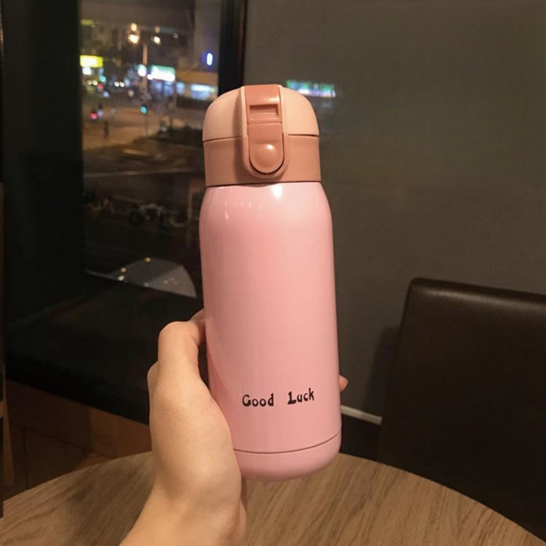 Insulated Water Bottle with Carry Strap made of Stainless Steel - Leakproof, Portable Travel Mug for Hot and Cold Drinks, Perfect for Outdoor Adventures & Halloween Presents.