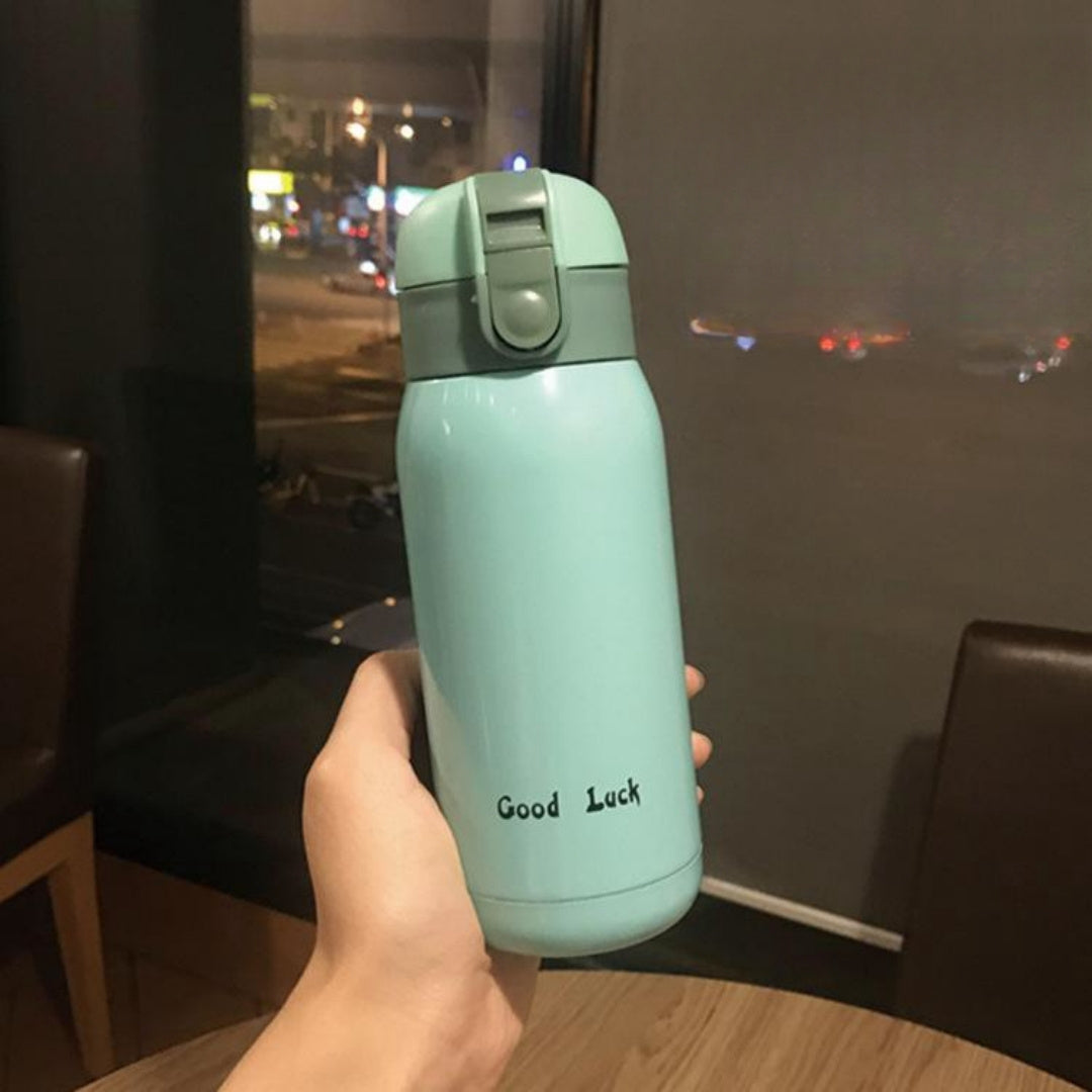 Insulated Water Bottle with Carry Strap made of Stainless Steel - Leakproof, Portable Travel Mug for Hot and Cold Drinks, Perfect for Outdoor Adventures & Halloween Presents.