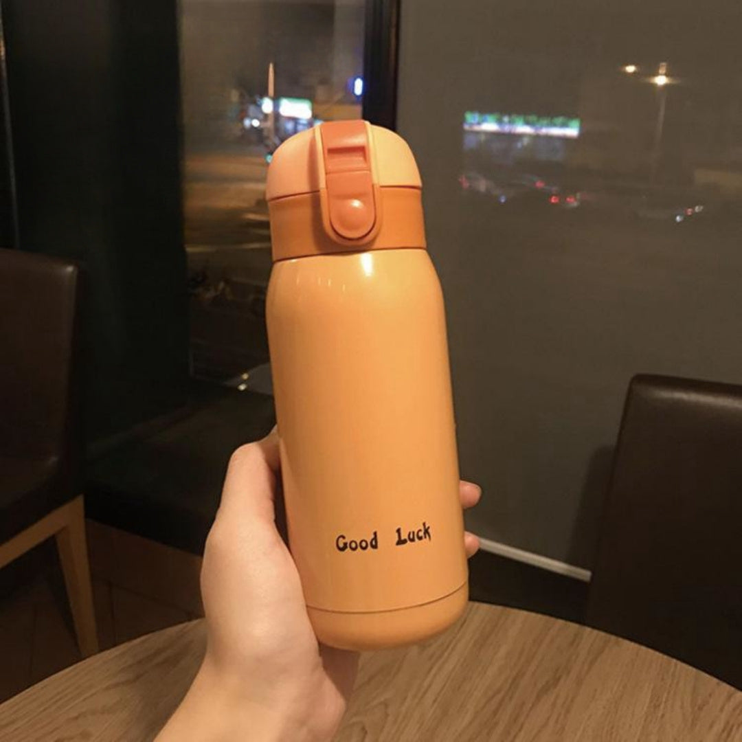 Insulated Water Bottle with Carry Strap made of Stainless Steel - Leakproof, Portable Travel Mug for Hot and Cold Drinks, Perfect for Outdoor Adventures & Halloween Presents.