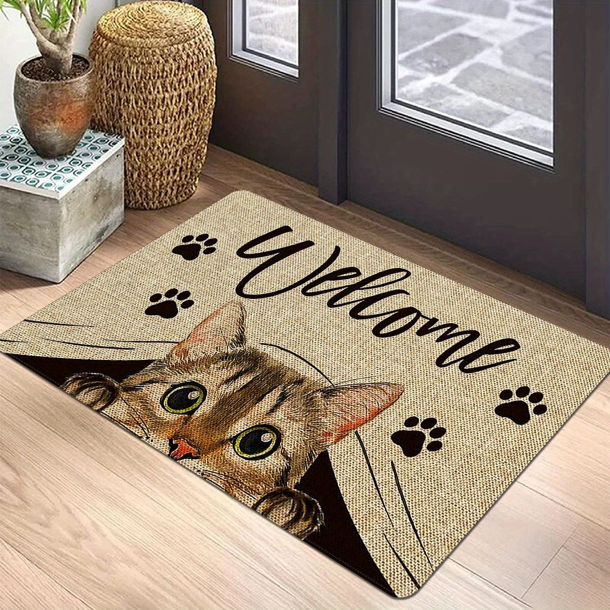 One piece of polyester entrance area floor mat featuring a printed pattern with cat elements and "Welcome Home" text. This non-slip, stain-resistant soft floor mat is suitable for indoor or outdoor use, including as a quick dry kitchen mat. Perfect for