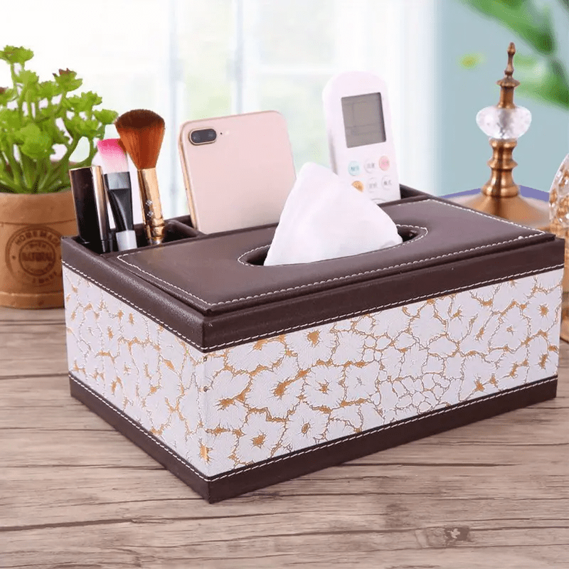 Versatile faux leather tissue and storage box with four compartments, ideal for coffee table and living room. Includes remote control holder and napkin organizer, perfect for home