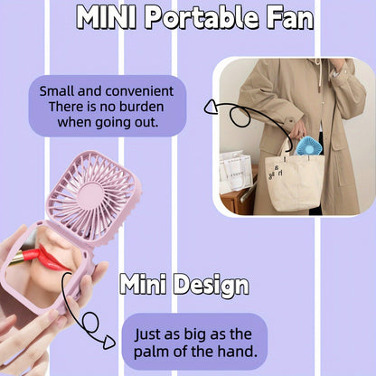 Mini Foldable Desktop Block with Mirror, Multi-functional Handheld Portable Pocket Fan with USB Charging. Can be used as a Hanging Neck Fan or placed on a Desktop. Features Mute Operation and Large Wind Output. Ideal for Creative Desktop Use in the