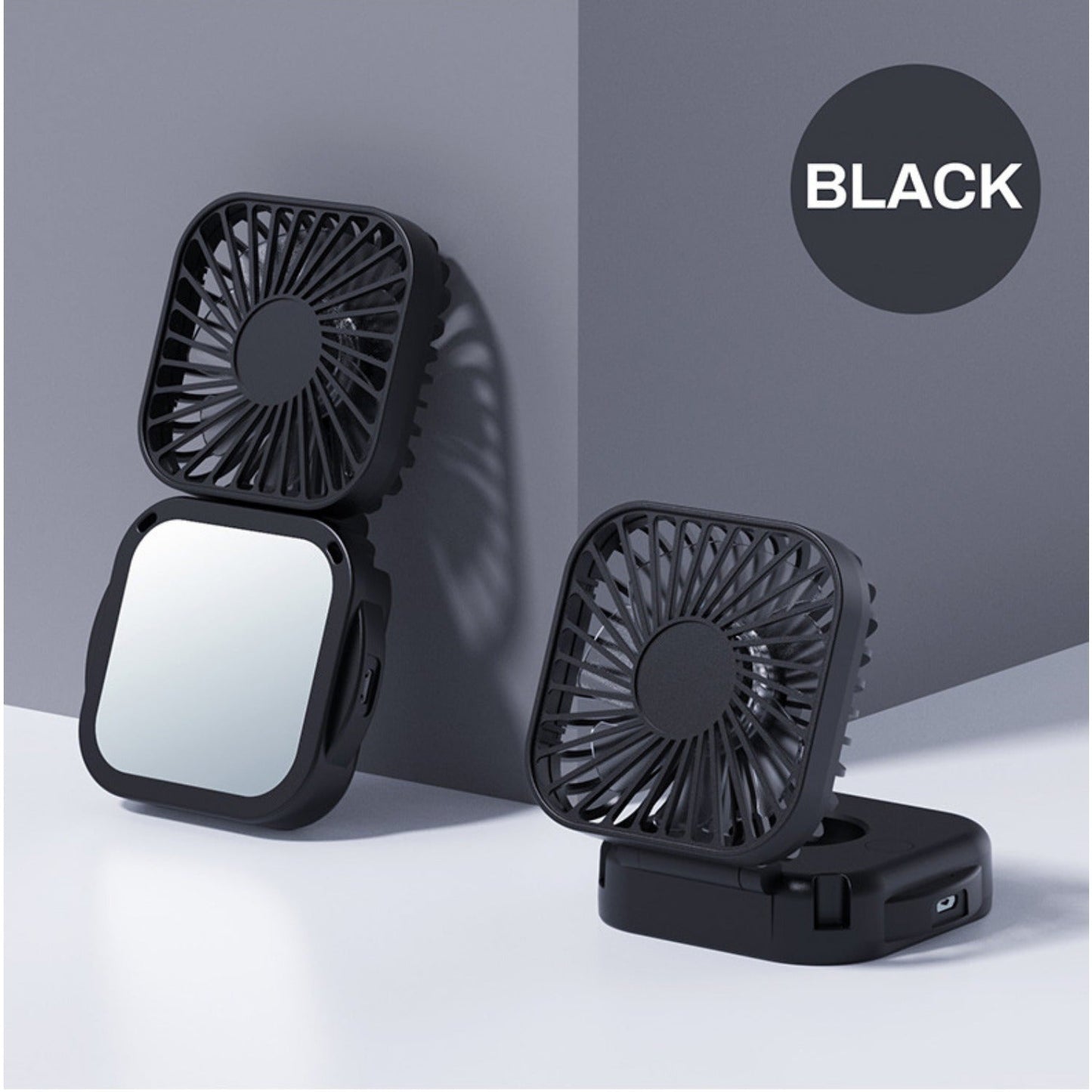 Mini Foldable Desktop Block with Mirror, Multi-functional Handheld Portable Pocket Fan with USB Charging. Can be used as a Hanging Neck Fan or placed on a Desktop. Features Mute Operation and Large Wind Output. Ideal for Creative Desktop Use in the