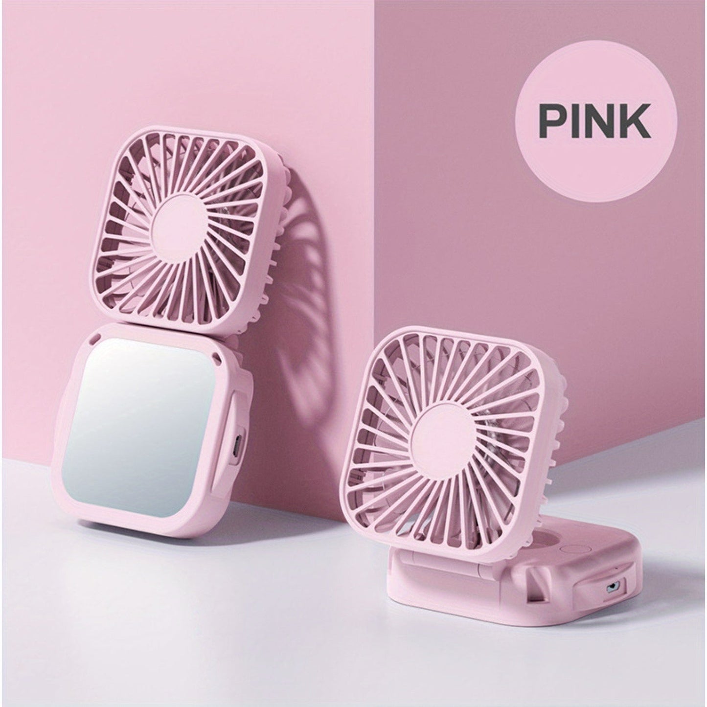 Mini Foldable Desktop Block with Mirror, Multi-functional Handheld Portable Pocket Fan with USB Charging. Can be used as a Hanging Neck Fan or placed on a Desktop. Features Mute Operation and Large Wind Output. Ideal for Creative Desktop Use in the