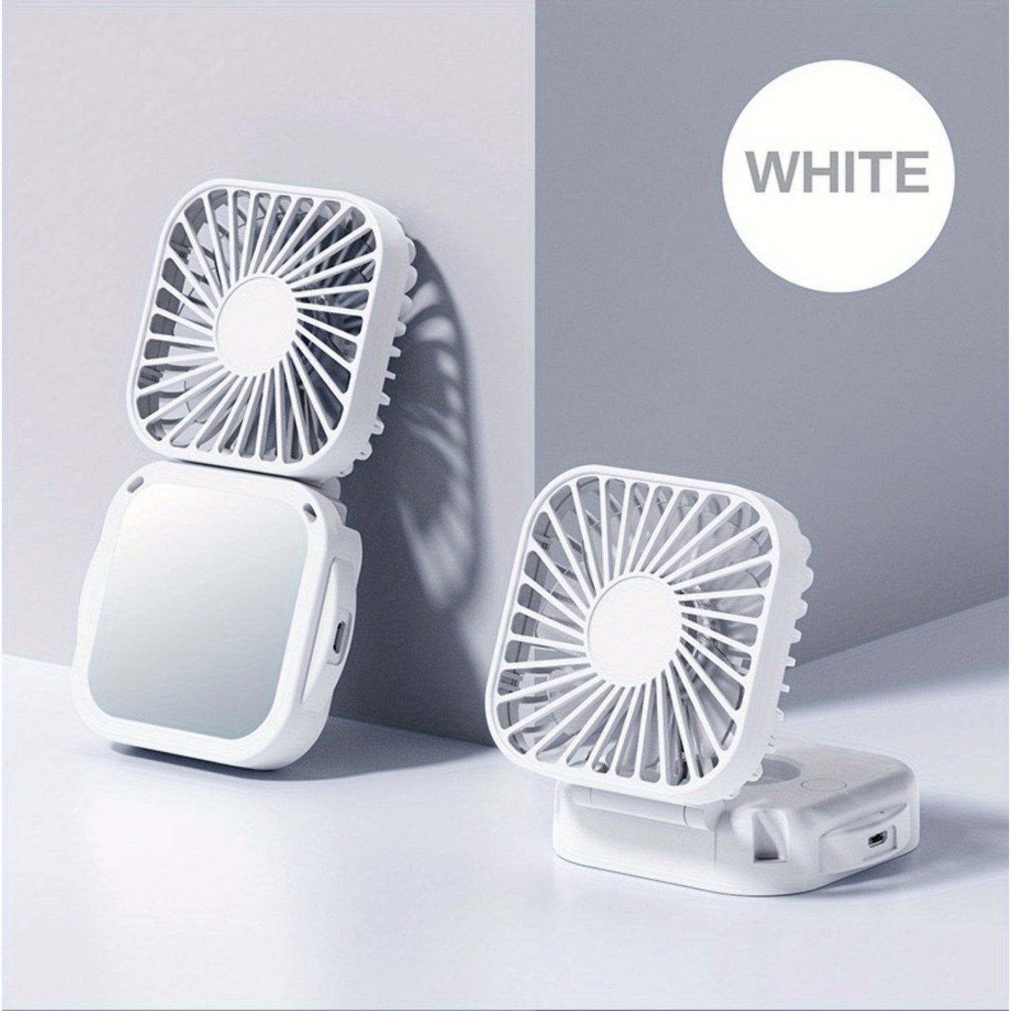 Mini Foldable Desktop Block with Mirror, Multi-functional Handheld Portable Pocket Fan with USB Charging. Can be used as a Hanging Neck Fan or placed on a Desktop. Features Mute Operation and Large Wind Output. Ideal for Creative Desktop Use in the