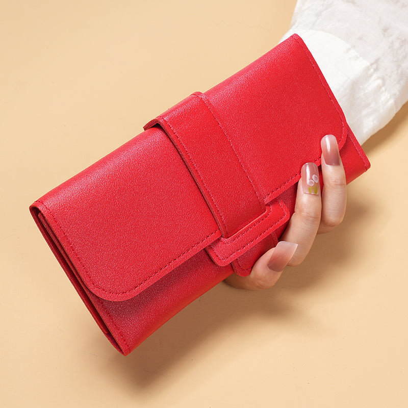 Stylish women's long wallet with multiple card slots and coin purse, features a chic buckle clutch for mobile phone.