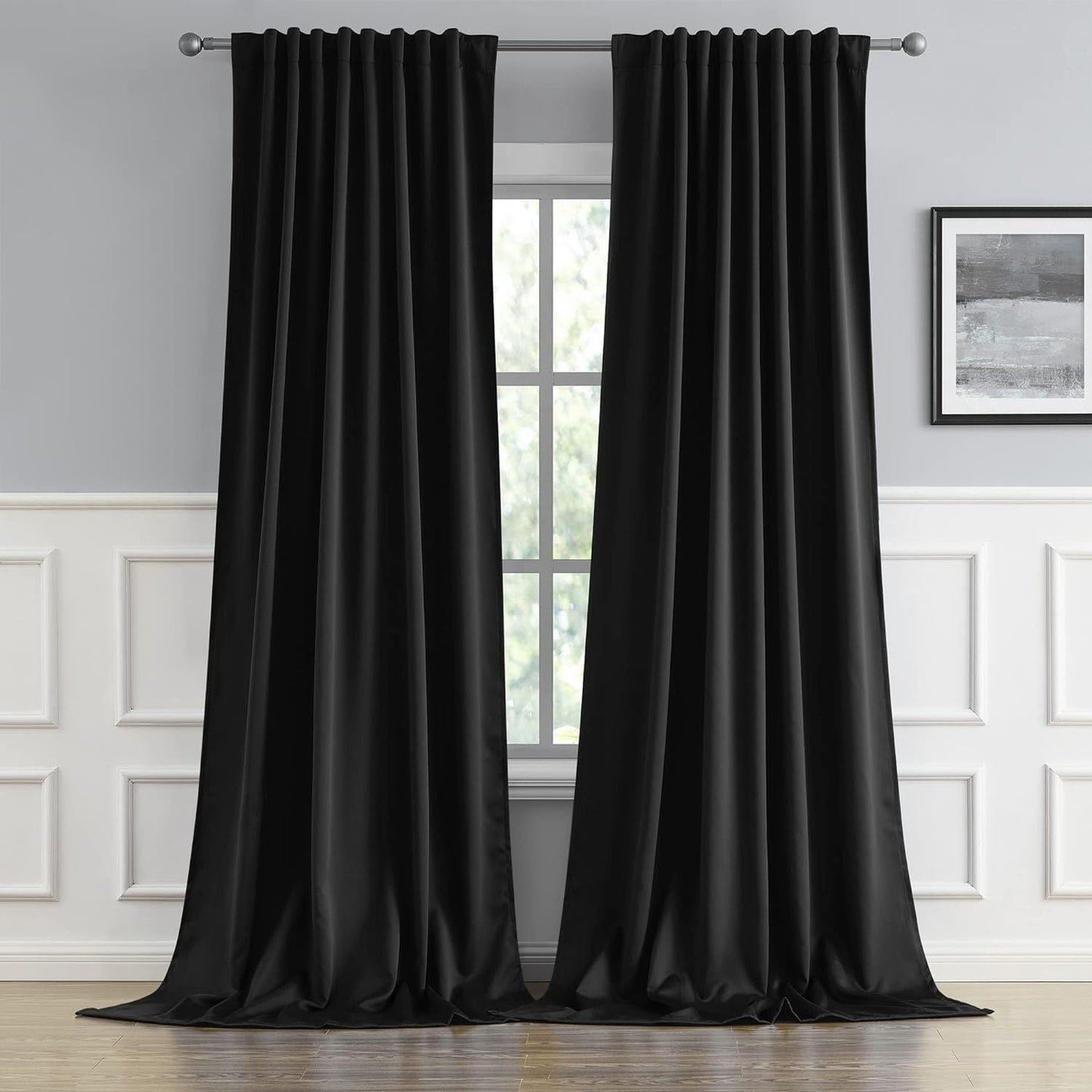 Cream and black thermal insulated blackout curtains with two panels. Perfect for darkening a room and providing insulation. Features back tab and rod pocket design for easy installation in a living room.