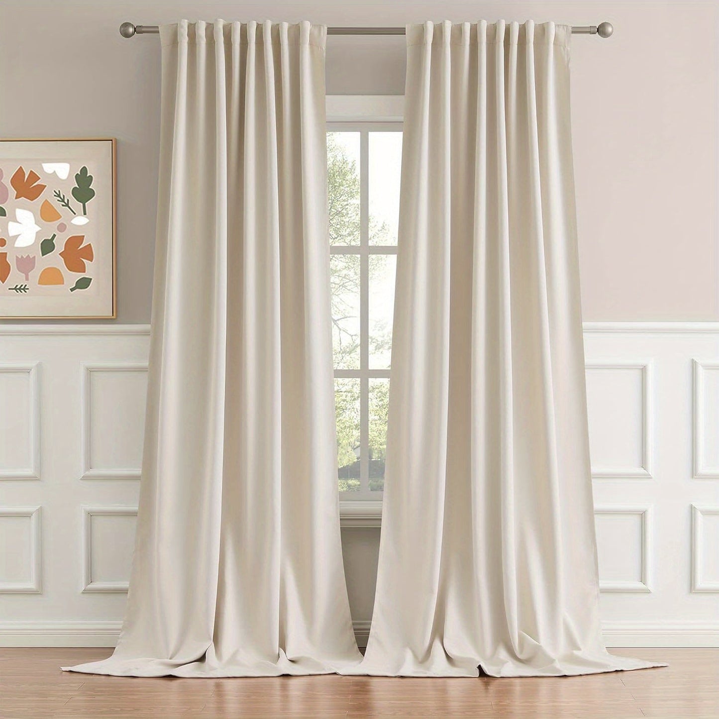 Cream and black thermal insulated blackout curtains with two panels. Perfect for darkening a room and providing insulation. Features back tab and rod pocket design for easy installation in a living room.