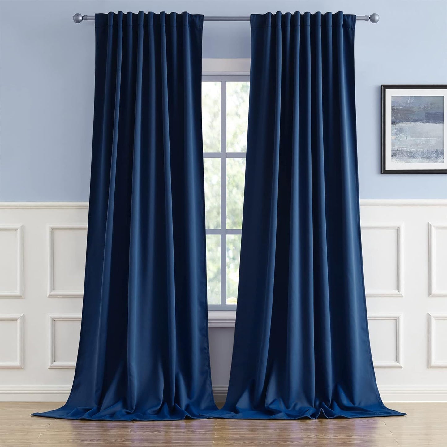 Cream and black thermal insulated blackout curtains with two panels. Perfect for darkening a room and providing insulation. Features back tab and rod pocket design for easy installation in a living room.