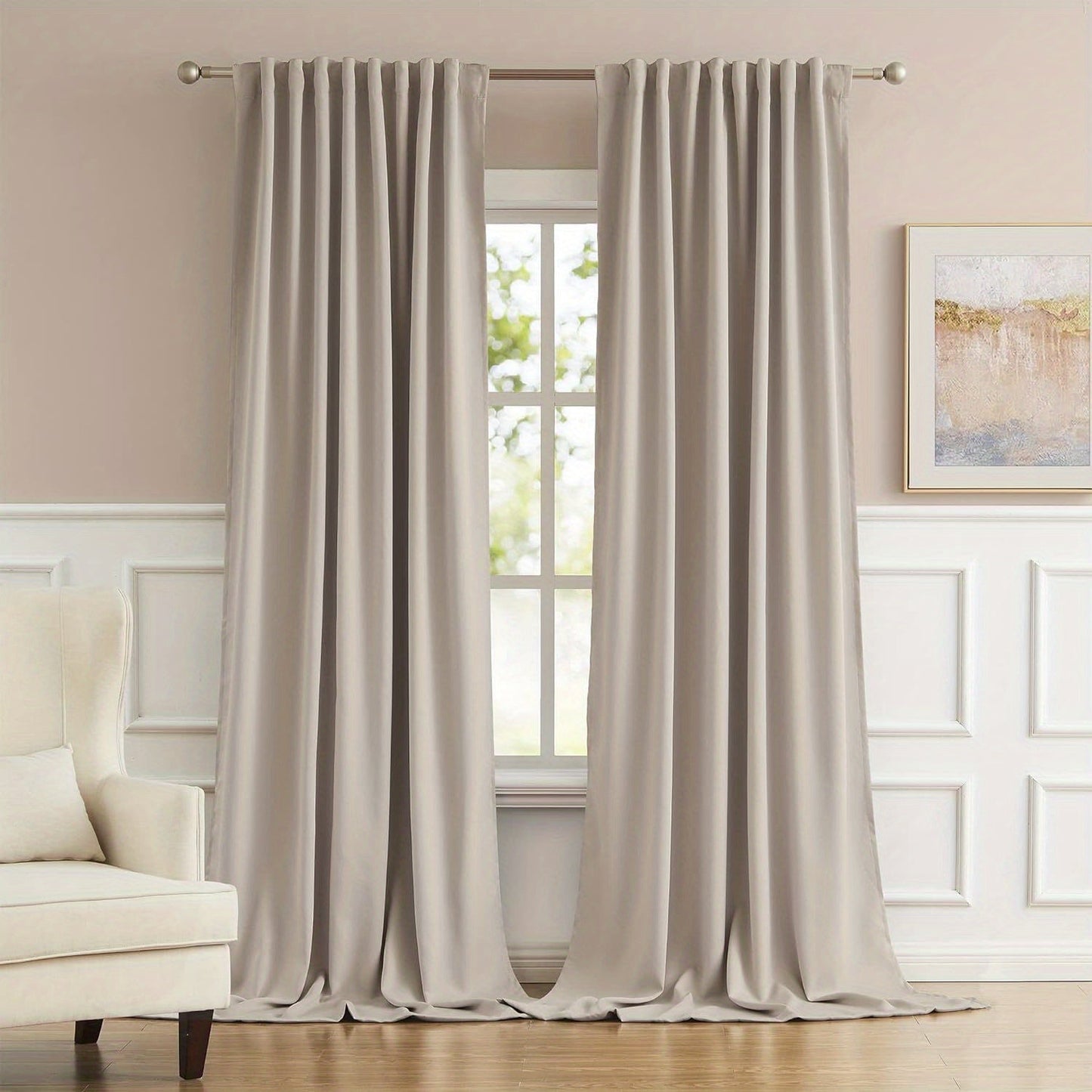 Cream and black thermal insulated blackout curtains with two panels. Perfect for darkening a room and providing insulation. Features back tab and rod pocket design for easy installation in a living room.