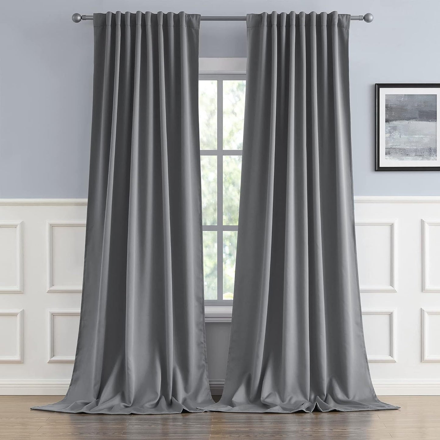 Cream and black thermal insulated blackout curtains with two panels. Perfect for darkening a room and providing insulation. Features back tab and rod pocket design for easy installation in a living room.