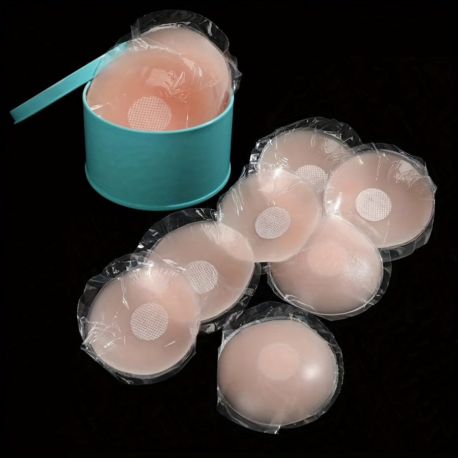 10 pack of reusable silicone nipple covers in light pink with a dotted pattern. Self-adhesive and strapless for invisible wear. Hand washable for nipple protection with a seamless design.