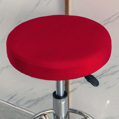 Stretchy round slipcover for bar stool, protecting furniture in dining, living, or office areas.