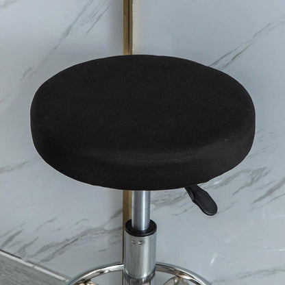 Stretchy round slipcover for bar stool, protecting furniture in dining, living, or office areas.