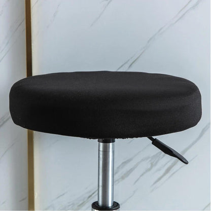 Stretchy round slipcover for bar stool, protecting furniture in dining, living, or office areas.