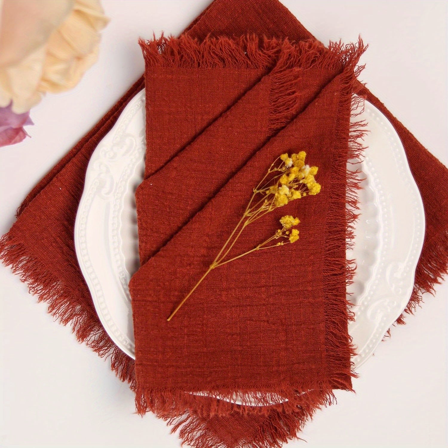 Handmade rustic linen napkins with fringe, 32.0x32.0 cm, in deep maroon. Perfect for elegant dining and cozy home decor at Boho weddings, Christmas, and parties.