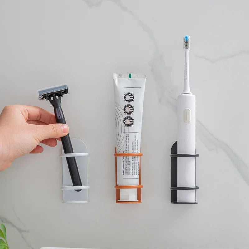 Get organized with our wall-mounted iron toothbrush holder! This space-saving solution features a compact design and drainage system, perfect for keeping your bathroom clutter-free. Available in white, orange, and black. No drilling required!