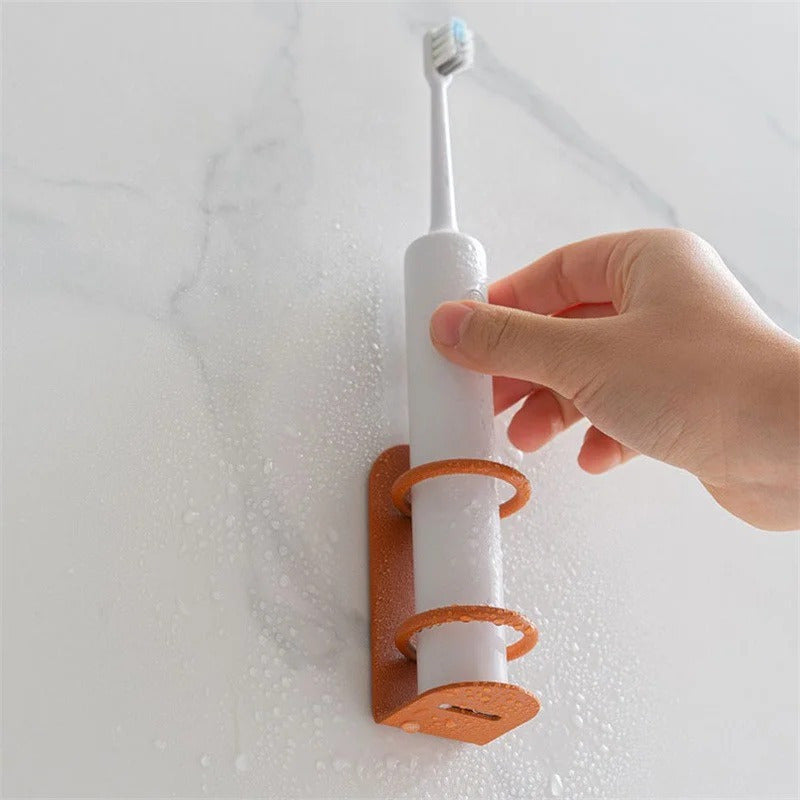 Get organized with our wall-mounted iron toothbrush holder! This space-saving solution features a compact design and drainage system, perfect for keeping your bathroom clutter-free. Available in white, orange, and black. No drilling required!