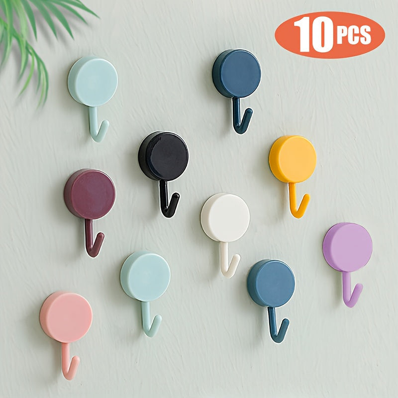 Ten self-adhesive wall hooks in a contemporary style that do not require electricity. These strong hangers are perfect for bedroom, bathroom, and kitchen use. They have a polished finish and are easy to install.