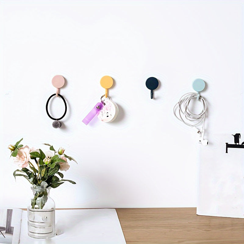 Ten self-adhesive wall hooks in a contemporary style that do not require electricity. These strong hangers are perfect for bedroom, bathroom, and kitchen use. They have a polished finish and are easy to install.