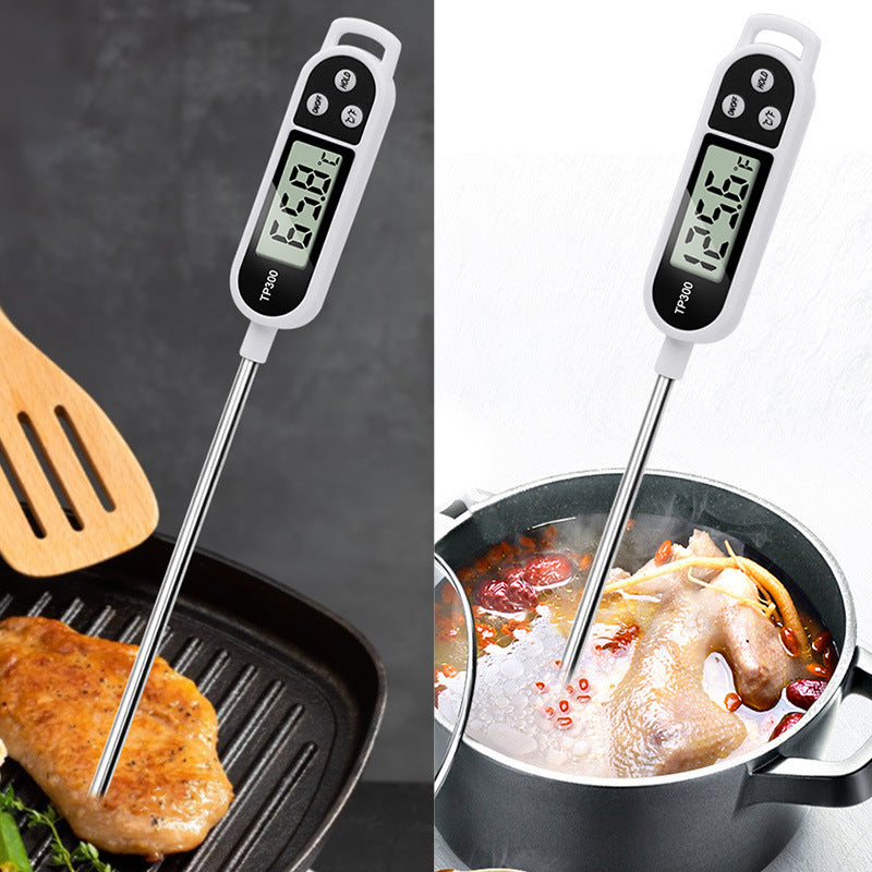 Stainless steel digital food thermometer TP300 with probe, ideal for BBQ, cooking, and baking. Dual display in Celsius & Fahrenheit, battery-operated kitchen tool.