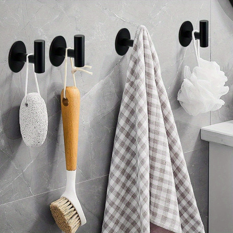 Stainless steel bathroom hook for hanging clothes.