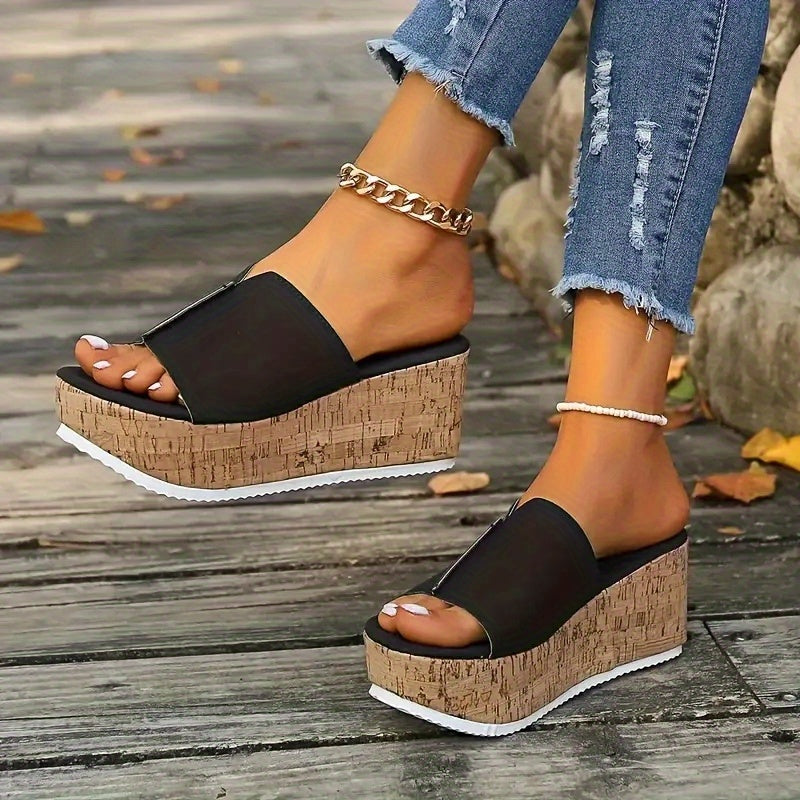 Black slide sandals for women with wood grain sole, open toe, high wedge heel, vegan cover strap, and platform style for summer.