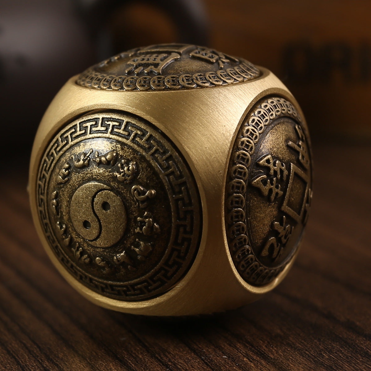 Brass stress relief sphere for prosperity and good fortune.