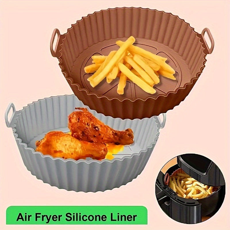 Reusable, non-stick silicone air fryer basket liner designed for 3QT-5QT air fryers. Heat resistant up to 240°C, perfect for baking and cooking. Available in blue and black, ideal for holiday parties and everyday kitchen use. Portable and folding with a