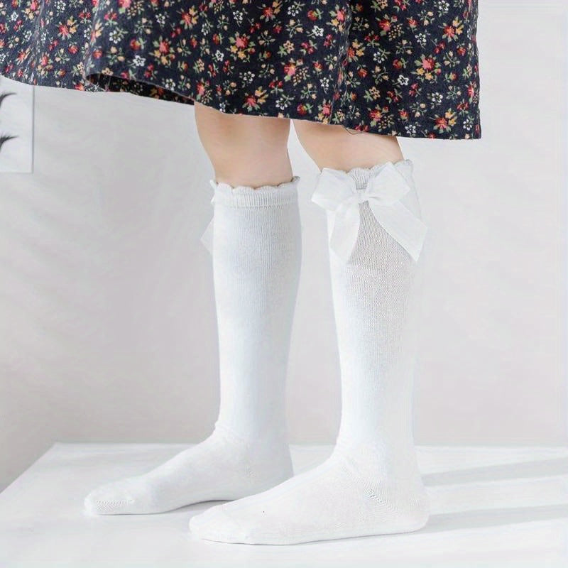 6 pairs of knee-high socks for kids aged 0-5 years in mixed colors, featuring ribbon bows and ruffled princess design.